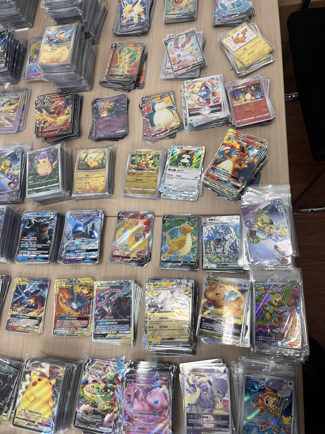 Original reference photograph of assorted sleeved Chinese Pokémon cards