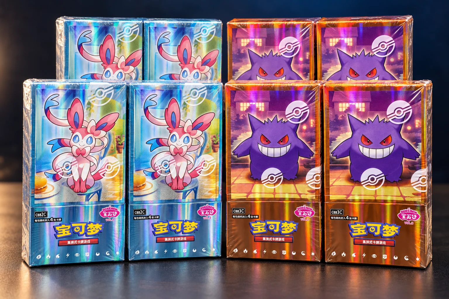 Styled group of Gem Pack Vol. 2 and Vol. 3 booster boxes
